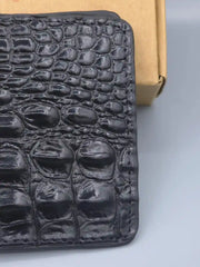 Black textured wallet on a light gray background