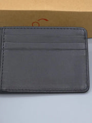 Gray leather wallet on a light gray background