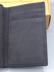 Close-up of a dark gray leather wallet with stitching detail on a light gray background.