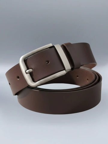 Brown leather belt with a silver buckle on a light gray background