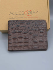Brown textured wallet in front of an Accesoriez box on a light gray background