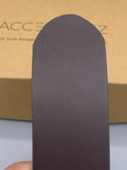 Black sandal sole held in front of a cardboard box with 'ACCESS' branding.