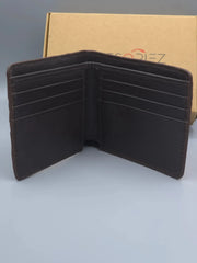 Brown leather wallet with visible brand logo on a gray background