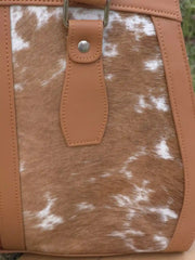 Bag with cowhide leather pattern and tan leather strap