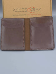 Brown leather wallet with 'Accesoriez' branding on a gray background
