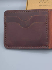 Brown leather wallet on a light gray background