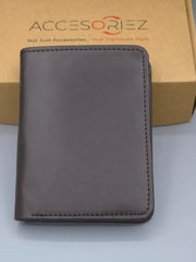 Brown leather wallet on a light gray surface with 'AccesorieZ' branding in the background.