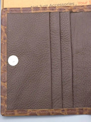 Brown leather wallet with visible stitching on a light blue background