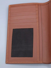 Brown leather wallet with a black mesh pocket on a light gray background