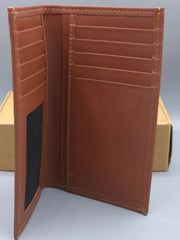 Brown leather wallet with stitching details on a light gray background