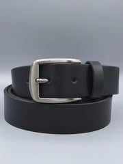Black leather belt with a silver buckle on a light gray background