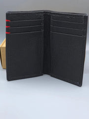 Black leather wallet with red strip on a light gray background