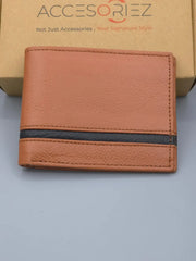 Brown leather wallet with black strip on a gray surface, brand 'Accesorize' visible.