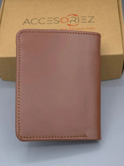Brown leather wallet on a light gray surface with 'Accesoriez' branding in the background.
