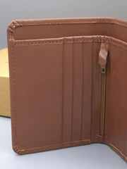 Brown leather wallet with a zipper on a light gray background