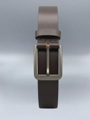 Brown leather belt with a silver buckle on a light gray background