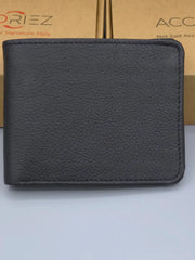 Black leather wallet on a light blue background with a brand box in the background.