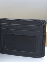 Black wallet with a card holder on a light gray background